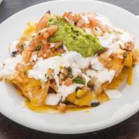 Nachos · Homemade tortilla chips; refried beans, choice of meat, guacamole, pico de gallo, sour cream...