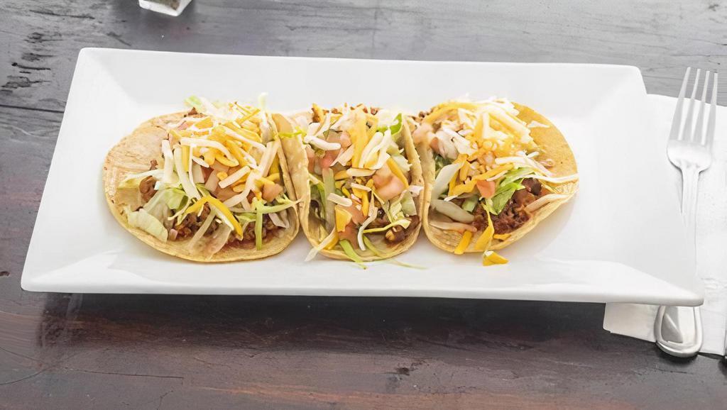 Ground Beef Taco · 3 crispy tacos. Ground beef, pico de gallo, lettuce and cheese.