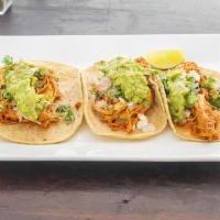 Tinga Tacos · 3 soft tacos. Shredded chicken sauteed with onions in a medium chipotle sauce. Comes in home...