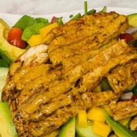 Isabela Pollo Tropical Con Mango / Tropical Isabela Chicken Mango Salad · Spicy chipotle grilled chicken, mixed greens, diced mango, cherry tomatoes, cucumber, red on...