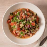 Afghan Salad · Diced tomatoes, cucumbers and red onions tossed in fresh lemon juice and olive oil. Seasoned...
