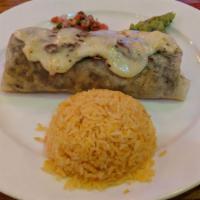 Grill Steak Burrito · With mozzarella and bean wrapped on a tortilla. Served with rice, pico de gallo, and guacamo...