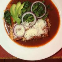 Enchiladas · Four rolled corn tortillas coated with your favorite salsa verde, roja or mole poblano, melt...