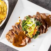 Skirt Steak · Grilled to perfectionon Guinness beer and Ron Abuelo Rum sauce reduction topped with gremola...
