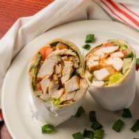 Chicken Caesar Salad · A tortilla wrap overstuffed with crisp romaine lettuce, tossed with creamy Caesar dressing.