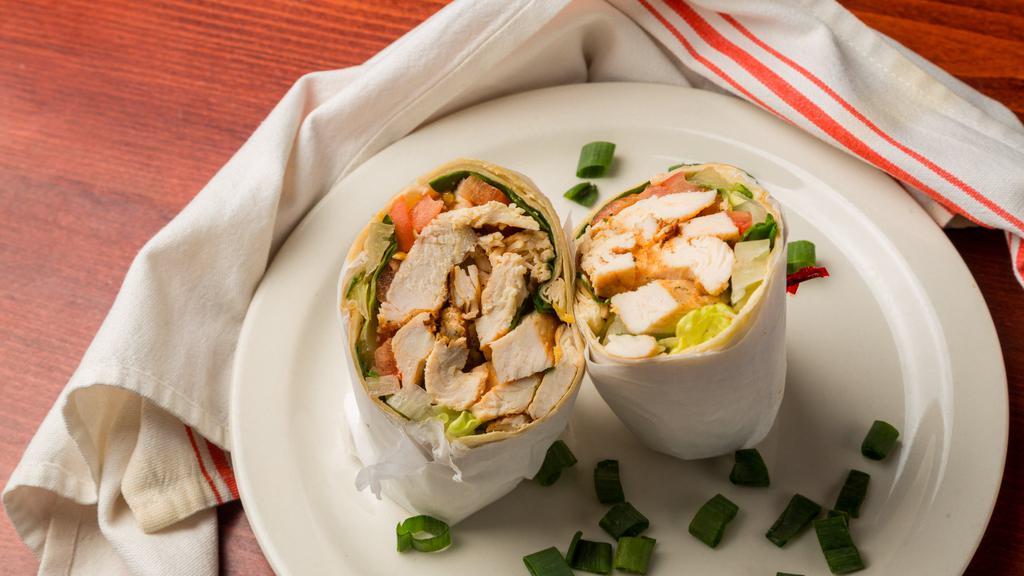Chicken Caesar Salad · A tortilla wrap overstuffed with crisp romaine lettuce, tossed with creamy Caesar dressing.
