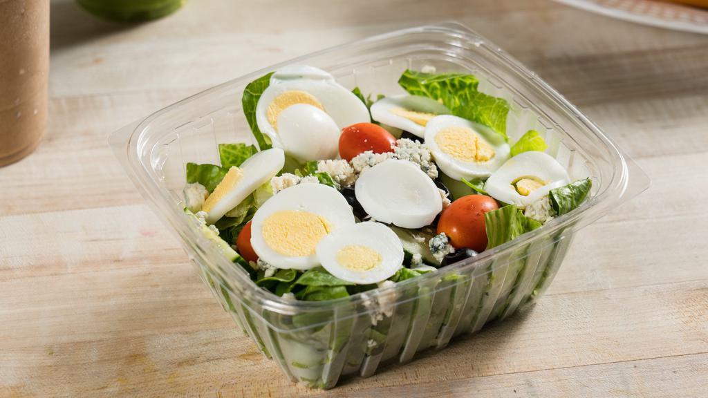 Cobb Salad · Romaine lettuce with bleu cheese, hard-boiled egg, black olives, cherry tomatoes and cucumbers with a house balsamic dressing.