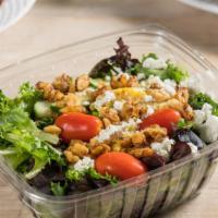Mixed Greens Salad · Mixed greens, goat cheese, roasted walnuts, cherry tomatoes and cucumbers with house dressing.