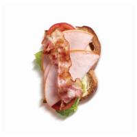 Half Turkey Blt Sandwich · Sliced turkey, turkey bacon, lettuce, tomatoes, and mayonnaise.