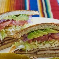 Breaded Chicken Torta
 · Served with mayo, fried beans, lettuce, tomato, avocado, oaxaca cheese, red onion and jalape...