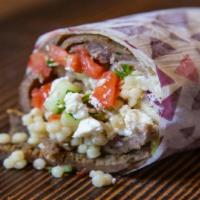 The Greek (Gyro Roll) · Gyro in Laffa with  Cous Cous, Lettuce, Tomato, Cucumber and Tzatziki