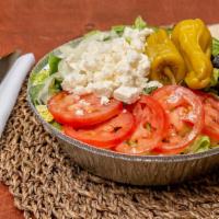 Greek Salad · With feta cheese, kalamata olives, grape leaves & anchovies upon request. served over fresh ...