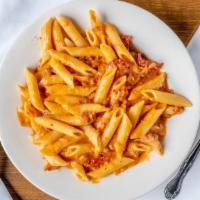 Penne Alla Vodka · With bacon, sun-dried tomatoes and romano cheese