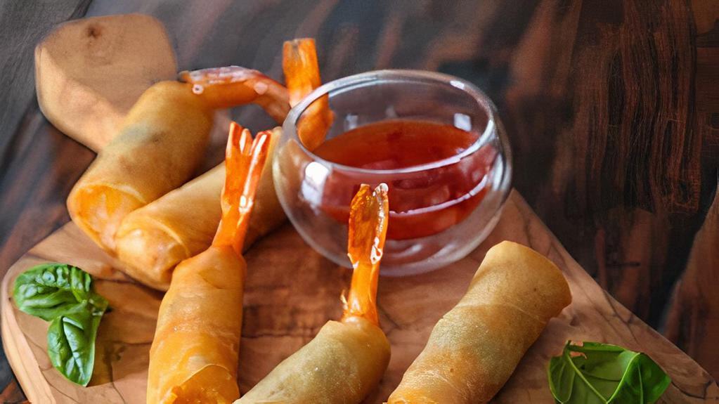 Crab Meat &  Shrimp Rolls  · Large shrimp,  crab meat  and thai herbs wrapped in a crispy skin spring roll and chili dipping sauce.
