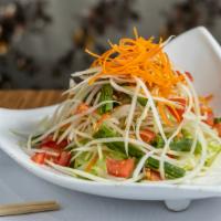 Som Tam Salad · Spicy.  Papaya salad. Thai stripped spice green papaya salad with string beans, tomatoes and...