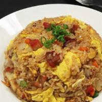N.1 Thai Combo Fried Rice · Chopped shrimp, chicken, Bbq roast pork, carrots, onions, scallions and egg with light soy s...