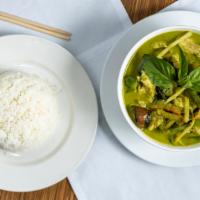 Green Curry · Spicy.  Eggplant, basil, bamboo shoot, string beans, carrots and bell pepper in coconut gree...