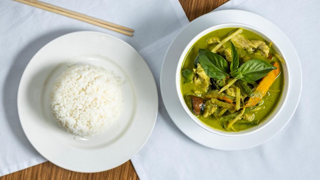Green Curry · Spicy.  Eggplant, basil, bamboo shoot, string beans, carrots and bell pepper in coconut green curry. Spicy.