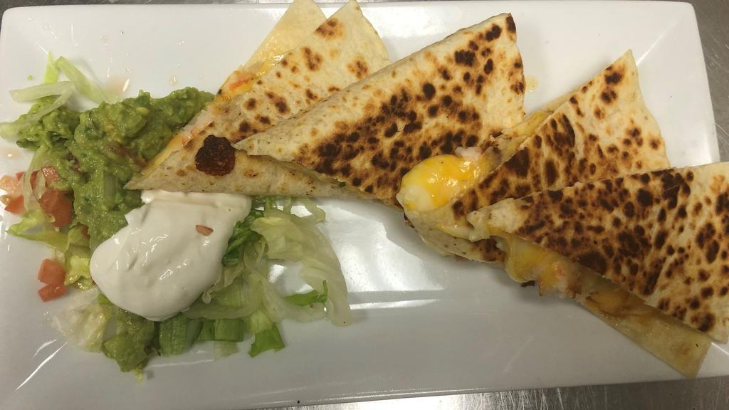 Chicken Quesadilla Apt · Flour tortilla filled with chicken and cheese and pico de gallo served with guacamole and sour cream.