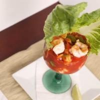 Mexican Style Shrimp Cocktail · Shrimp served chilled in red sauce with tomatoes, onions, orange juice and avocado.