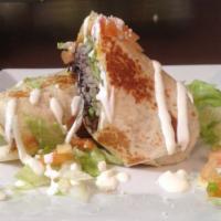 Traditional  Burrito · Flour tortilla filled with choice of meat, sauteed onions, bell peppers, rice, black beans, ...