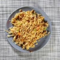 Arroz Chaufa Con Pollo · Peruvian-style fried rice mixed with chicken, eggs, onions and soy sauce.