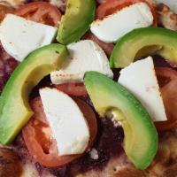 Avocado Flatbread · Black olives, tomato, goat cheese with olive oil.