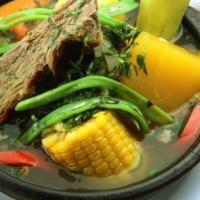 Cazuela De Vacuno / Cow'S Soup · Un gran trozo de carne, patatas, trozo de calabaza, maíz, arroz y judías verdes. Todo en abu...