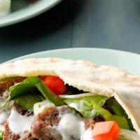 Beef Gyro · Beef, lettuce, tomato and optional white sauce. On our delicious house made pita bread.