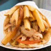 Chicken Gyro · All natural chicken gyro, lettuce, tomato and optional white sauce. On our delicious house m...