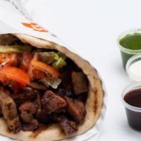 Lamb Gyro · Served on pita with choice of salad and Shah's sauces.