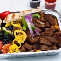 Lamb Over Rice · Served over brown basmati rice with choice of salad and Shah's sauces.