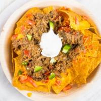 Piggy Pork  Nachos Supreme · Medium Size Fresh Corn Tortillas with Pulled Pork loaded with Cheddar Cheese & Chopped Tomat...