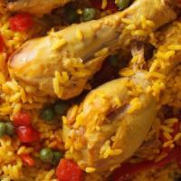 Paella Latin Rice Dish · Delicious Spanish yellow saffron rice with your choice of Chicken, Pork and Shrimps