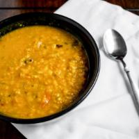 Tadka Dal Entrée · Boiled yellow lentil tempered with cumin, mustard, garlic and curry leaves.
