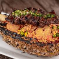 Arroz Caribeno · Grilled pineapple, special rice, shrimps, churrasco sewer