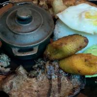 Bandeja Paisa · Colombian platter with grilled steak, rice, beans, fried egg, pork skin, and sweet plantain....