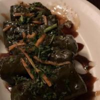 Dolma – Grape Leaves · Tenderized grape leaves rolled with savory vegetable and rice mix with lemon and pomegranate...