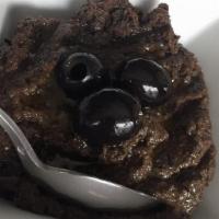 Olive Paste · Pureed black olives with garlic and olive oil. Served with 1pc of pita.