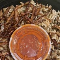 Mujaddara · Lentils and rice, seasoned with cumin, topped with caramelized onions, and served with Fez t...
