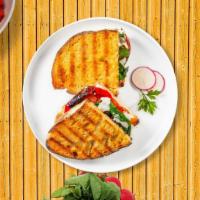 Spinach Delight Panini · Fresh mozzarella cheese with plum, tomatoes, and spinach sun-dried tomato spread on toasted ...