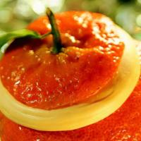 Orange Vegan Sorbet · Refreshing orange sorbet served in the natural fruit shell. (Frozen)