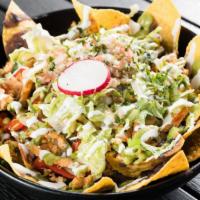 Chicken Fajita Nachos · Onions, roasted red & green peppers served with black beans, shredded Mozzarella cheese, gua...