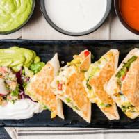 Chicken Tinga Quesadilla · Shredded chicken chipotle. Served in a flour or whole wheat tortilla with melted Mozzarella ...