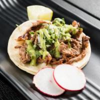 Grilled Steak Taco · Served with cilantro, onions, radish and lime.