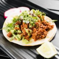 Chorizo Taco · Mexican sausage. Served with cilantro, onions, radish and lime. Spicy.