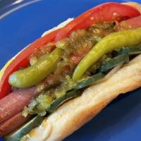 Chicago Style Dog · Tomato, pickle, relish, sport peppers, onions, mustard, and celery salt.
