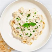 Too Alfredo To Love You Pasta · Fettuccine pasta cooked in creamy white sauce and aged parmesan. Served with garlic bread.