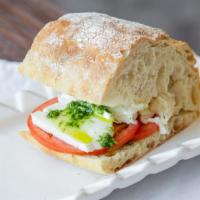 Mozzarella Sandwich  · Greens, mozzarella, tomato, basil sauce, ciabatta bread