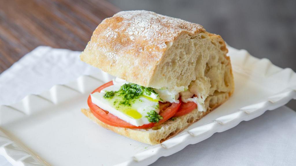 Mozzarella Sandwich  · Greens, mozzarella, tomato, basil sauce, ciabatta bread